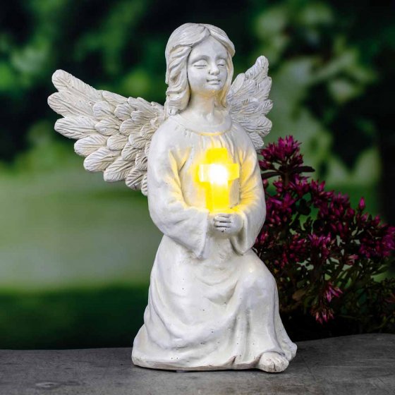 Zonne-engel met verlicht kruis 