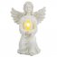 Zonne-engel met verlicht kruis - 2